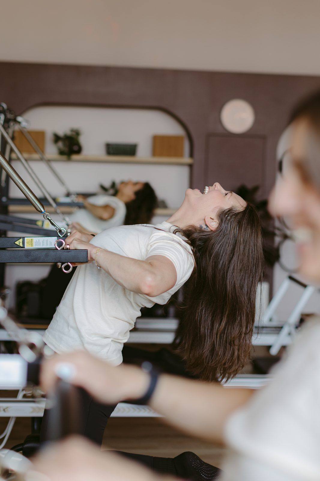 A client learning foundational reformer technique in a Level 1 class at Leaside Pilates