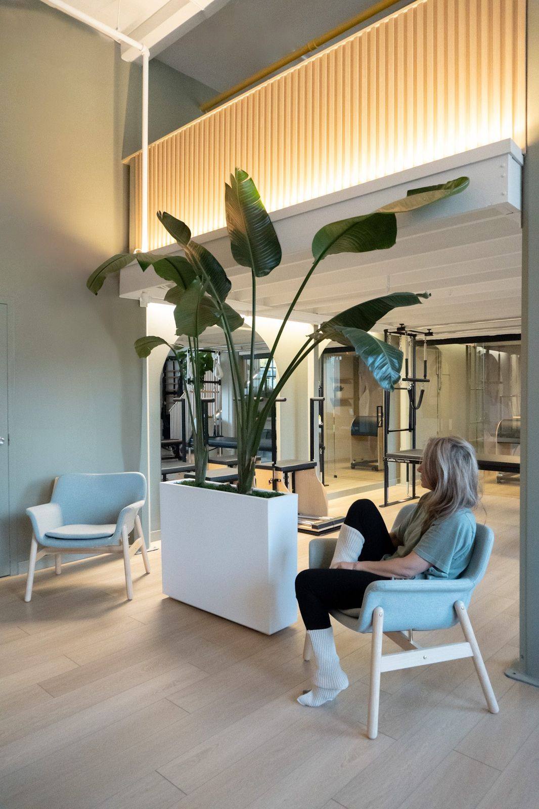 A client relaxing in the lounge at Leaside Pilates